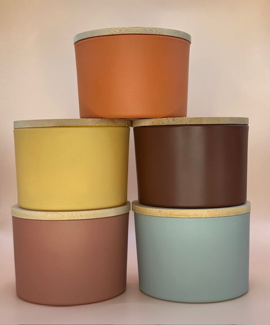 D. 4 Ounce Nature Inspired Colored Glass Jar with Walnut or Pine Lid